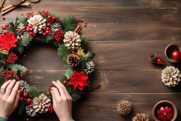 Wall Mural - Christmas wreath female adult hand.