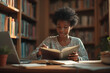 © Amir Bajric - Young black african american female school student reading educational book in college library