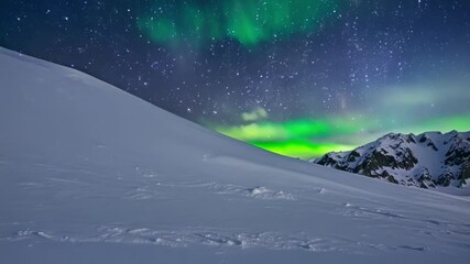mesmerizing green and blue aurora borealis dances over snowy mountain slope under starry night sky, 