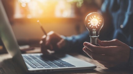 Leinwandbilder - Hands holding light bulb for concept of new ideas, innovative technology, science and communication concept.