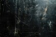 © grigoryepremyan - Black background with a dust and scratches texture for design.
