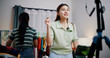 © Johnstocker - Portrait of Two cheerful woman influencers are live streaming sell clothes on social media or blogging in home studio. Remote buying, Online shopping, Sell ​​products online