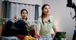 © Johnstocker - Portrait of Two cheerful woman influencers are live streaming sell clothes on social media or blogging in home studio. Remote buying, Online shopping, Sell ​​products online