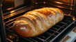 © Yeivaz - Golden artisanal bread slowly rising in the oven, wonderfully fragrant and ready to be served warm