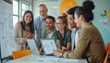 © Photo by mQ - Colleagues discussing a project at work, gathered around a conference table with laptops and documents, exchanging ideas and collaborating in a productive atmosphere