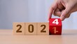 © Galeno - year strategy target planning business goal new year hand pushes wooden cubes red calendar showing symbolizing new startup next year