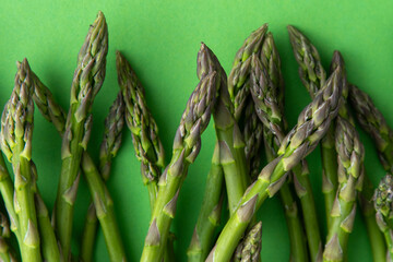 Green asparagus background. Fresh spring vegetable sprouts