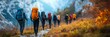 © paisorn - Mountain Trail Adventure, a group of hikers navigating a winding path, surrounded by a softly blurred, expansive landscape.