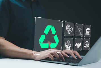 Recycle icon, Sustainable Development Concept. Person using a laptop with recycling icon, surrounded by various sustainability symbol, concepts of eco-friendly practices and sustainable development