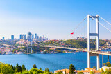 Istanbul Bosphorus Bridge or 15th July Martyrs Bridge with Istanbul panorama cityscape during summer sunny day. Istanbul, Turkiye.