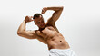 © master1305 - Strong, relief body. Handsome shirtless man posing in underwear, showing his athletic figure isolated on white studio background. Concept of male beauty, body and skin care, health, sport