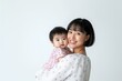 © Rawpixel.com - Happy young asian mother embracing her baby girl portrait photography background.