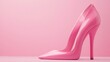 © Puttipong - A pair of pink high heels standing on a pastel pink background, representing fashion and femininity.