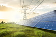 © piyaset - Solar farm and high voltage pole at sunset with nature background