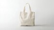 © Pricha.RT - A beige tote bag isolated on a clean white background, ideal for eco-friendly promotional designs.