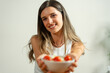© Lomb - Smiling young woman offering bowl of fresh salad: healthy lifestyle, nutrition, portrait, natural beauty, home cooking