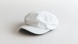 © Pricha.RT - A clean, minimalistic flat cap in plain white, placed on a neutral background, perfect for showcasing custom branding or design concepts.