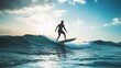 © Galib - A surfer rides a wave in the ocean at sunset.