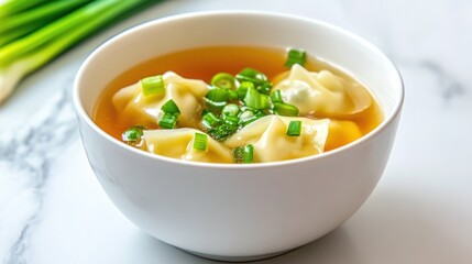 Delicious dumpling soup with fresh green onions