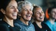 © pinkrabbit - Smiling group older of friends in sportswear laughing together while standing arm in arm in a gym after a workout, senior, healthy, friendship, adult, exercising, together, lifestyles