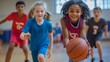 © Morning - Smiling girl dribbling basketball during a game with teammates.