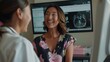 © spyrakot - Woman Consults with Doctor After Mammogram Review in High-Tech Medical Facility
