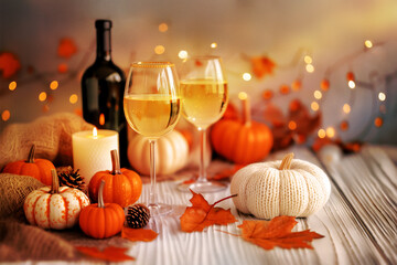 Wall Mural - Halloween & Thanksgiving wine party background, decorated with a wine glass, a wine bottle, a Jack-o-lantern, pumpkins, and fallen leaves on a white wall, a festive and elegant feel with bokeh effects