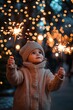 © spyrakot - Joyful Child Celebrating Christmas with Sparklers Under Festive Lights in Winter Wonderland