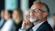 © KKC Studio - Thoughtful Businessman in Professional Meeting Setting