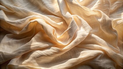 Delicate muslin fabric lies crumpled on a serene surface bathed in soft, warm sunlight with subtle shadows.