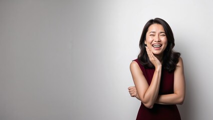 Wall Mural - Amused woman in plain white background