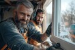 © Milos - Two experienced construction workers fit a window at a site, demonstrating skill and teamwork; the scene is bathed in natural light, in a developing neighborhood.