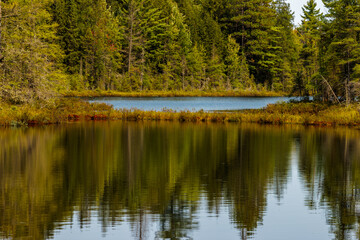 The bog has started to close in the two intersection sections of Devils Lake near Boulder Junction, Wisconsin in mid-September