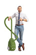 © Ljupco Smokovski - Man pointing at a green eco friendly vacuum cleaner