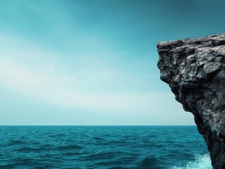 Cliffside ocean view with crashing waves, vast horizon, misty atmosphere, dynamic lighting, high contrast, wide panoramic shot