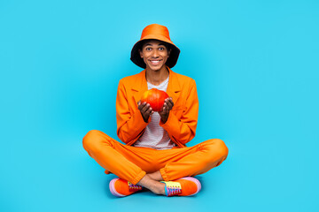 Poster - Photo of positive guy hold showing pumpkin gourd for thanksgiving day festival isolated cyan color background