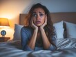 © Aodsy - Woman in Bed with Concerned Expression at Night