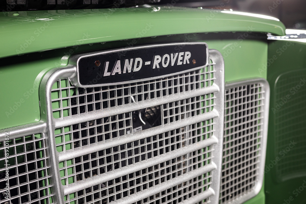 Land Rover Defender Sign Land Rover logo sign. Close up photo with the vintage logo on top of a ...