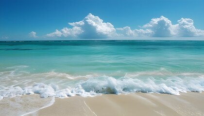 Tranquil beach with clear turquoise waters gently caressing soft sandy shores beneath a bright blue sky adorned with fluffy white clouds