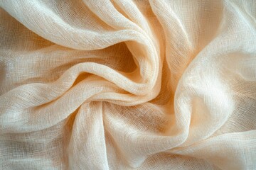 Close-up of a beige, patterned, and wrinkled sheer fabric