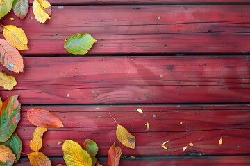 Autumn Leaves on Red Wooden Background - Copy Space