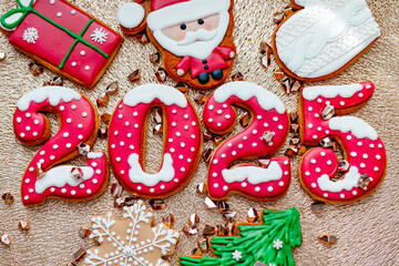 Wall Mural - Christmas and New Year banner gingerbread cookies numbers 2025 on golden background