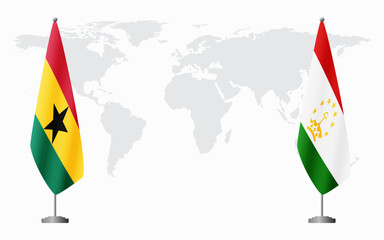 Ghana and Tajikistan flags for official meeting against background of world map.