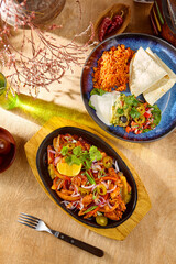 Sticker - Delicious Pork Fajitas with Fresh Vegetables on a Hot Skillet Plate