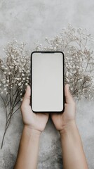 Canvas Print - A person holding a phone with a white screen