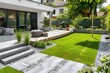 © Ruslan - Contemporary garden design with cobble paving concrete slab turf and wood terrace
