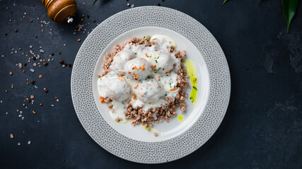 Wall Mural - Pork meatballs with buckwheat porridge and sauce.