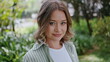 © stockbusters - Portrait smiling woman park looking camera confidently. Beautiful lady standing