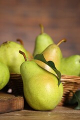 Sticker - Fresh green pears and leaf on wooden table, closeup