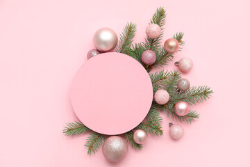 Wall Mural - Composition with blank card, beautiful Christmas balls and fir branches on pink background